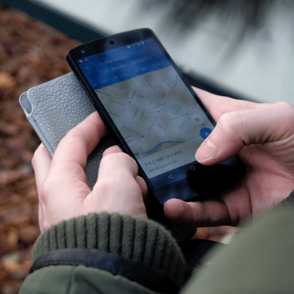 person looking at map on phone
